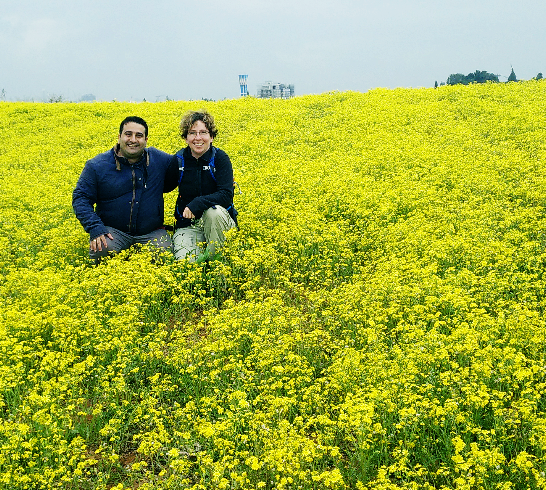Moshe and Ronit in a field of yellow flowers